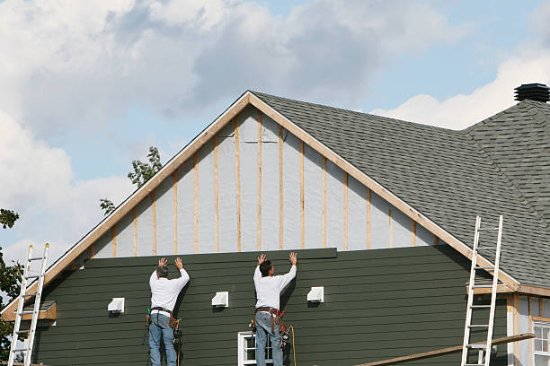 Professional Vinyl Siding technician working in Simpson, NC